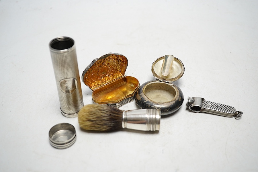 Small silver - a Victorian engine turned travelling shaving brush, mm. JV, London 1858, 8.5cm, a Continental white metal snuff box, 5.4cm, a portable ashtray case, 5cm diameter, and silver faced cigar cutter, Birmingham